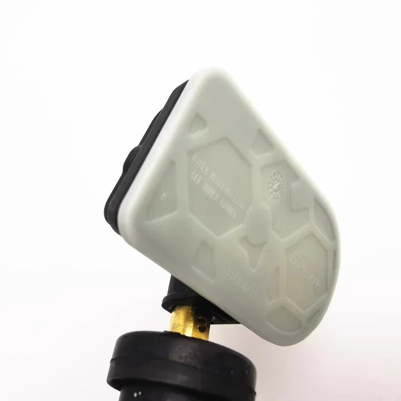 White durable plastic protective cap with black rubber base for automotive parts.
