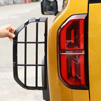 Black matte protective tail light guard grille for BYD vehicle rear light protection.