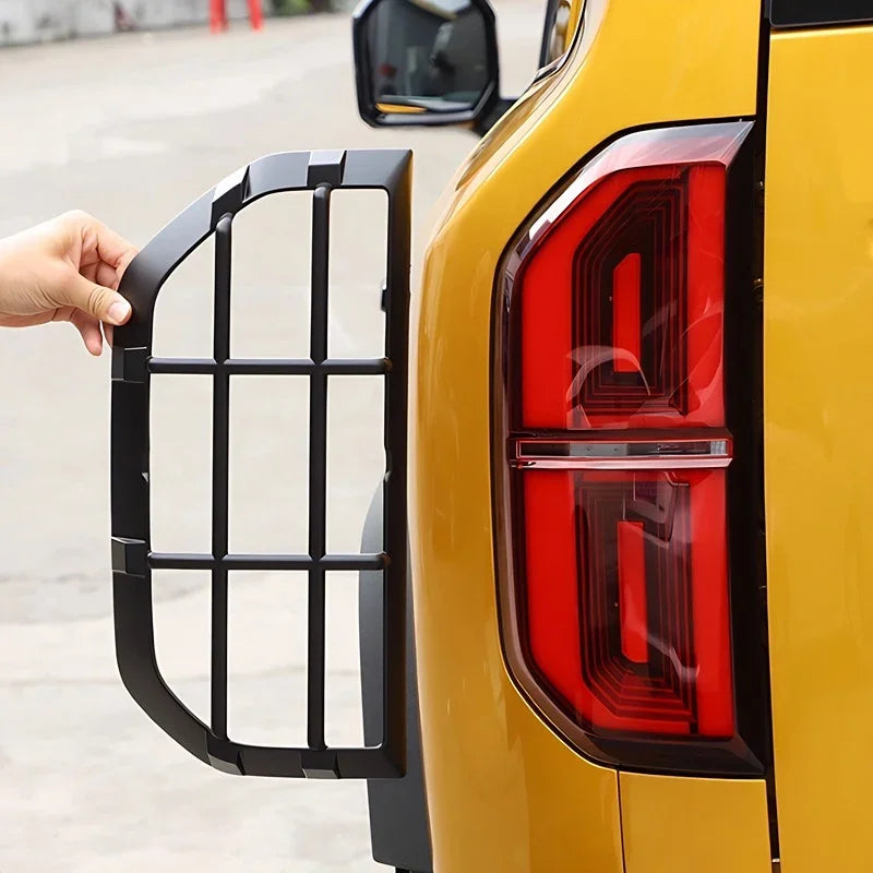 Black matte protective tail light guard grille for BYD vehicle rear light protection.