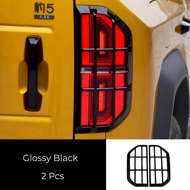 Glossy black protective tail light guard covers for BYD, durable material, 2-piece set.