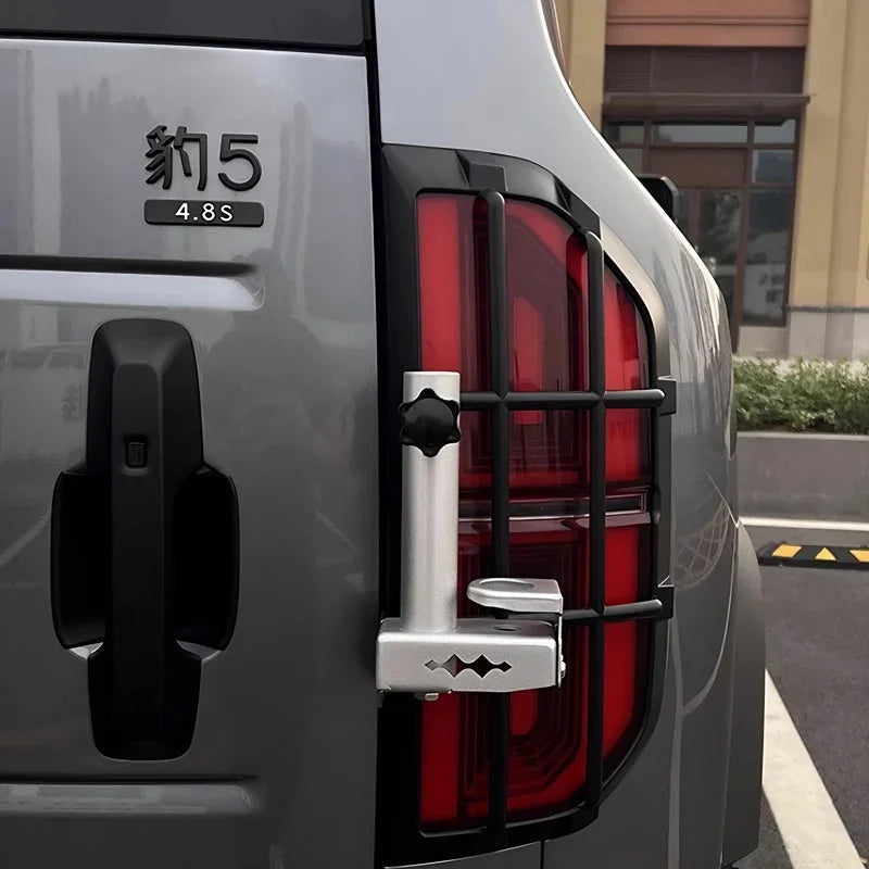 Silver aluminum rear tail light guard for gray BYD vehicle, featuring a protective grid design.