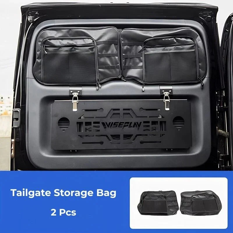 Set of two black heavy-duty fabric tailgate storage bags mounted on a vehicle's rear door.