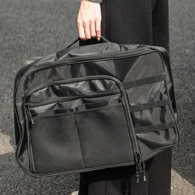 Black durable nylon car seat organizer with mesh pockets and multiple storage compartments.