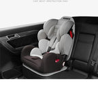 Grey and black car seat protection pad installed under a child safety seat in a vehicle.