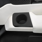 Matte black premium car interior cup holder integrated into a white console design.