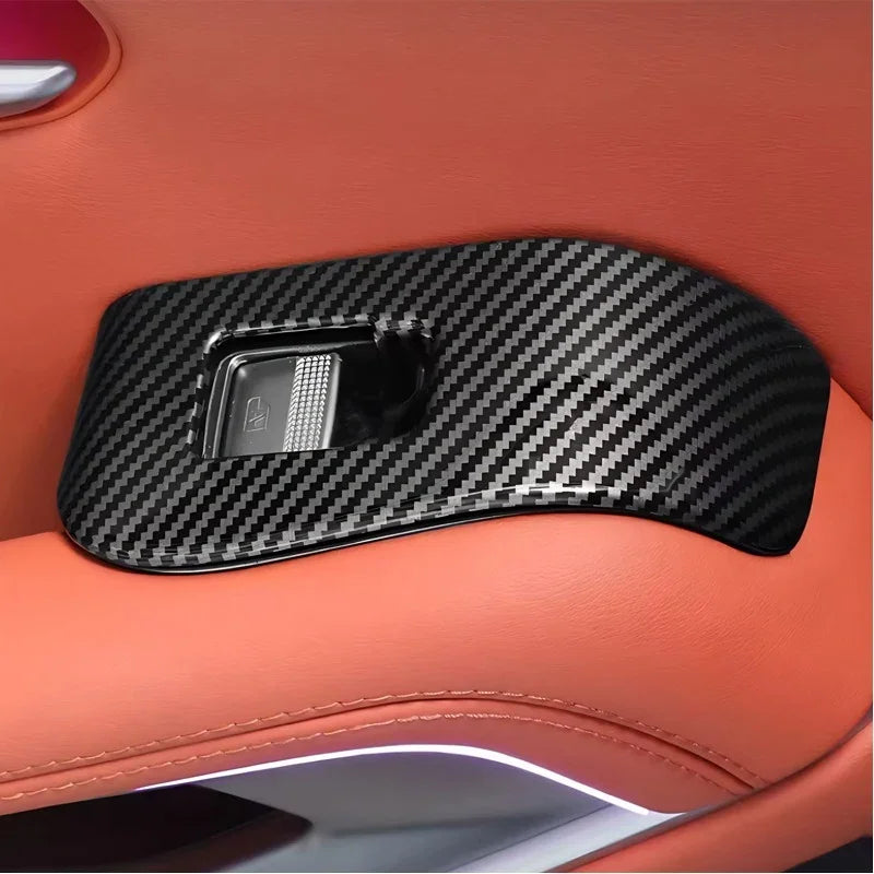 Black carbon fiber texture door handle trim cover for BYD interior enhancement.