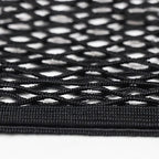 Close-up of a durable black mesh storage net made from high-quality synthetic fabric.