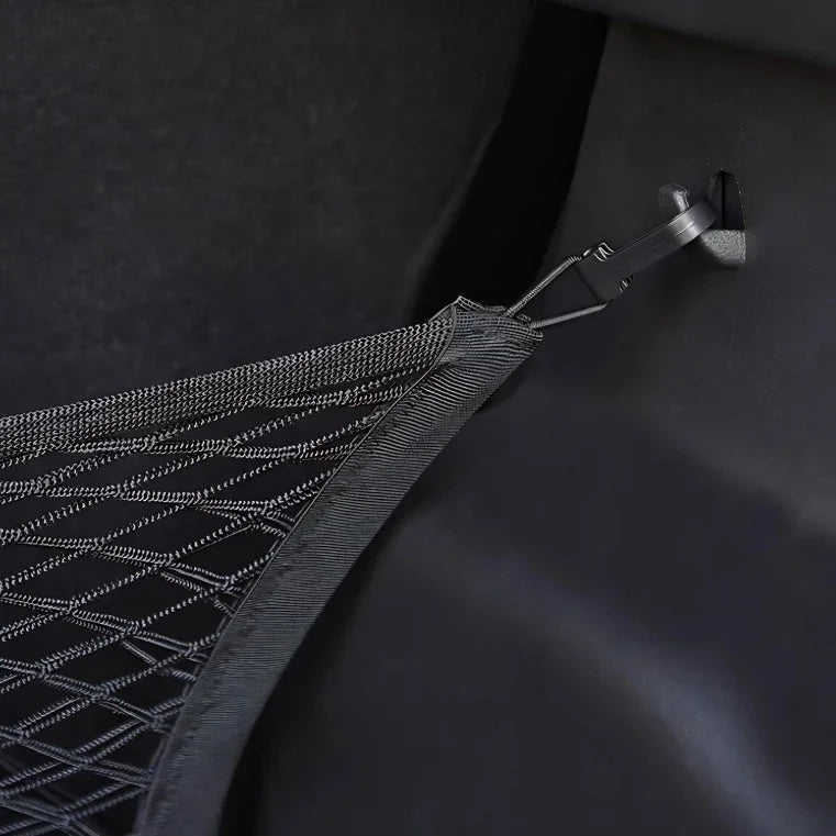 Close-up of a black mesh car storage net with a durable clip attachment.