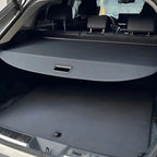 Black leather-textured retractable cargo cover for BYD trunk protection.