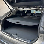 Black fabric retractable cargo cover for BYD SUV trunk protection.