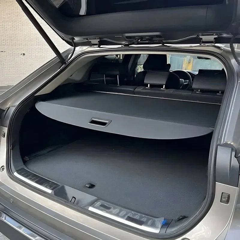 Black fabric retractable cargo cover for BYD SUV trunk protection.