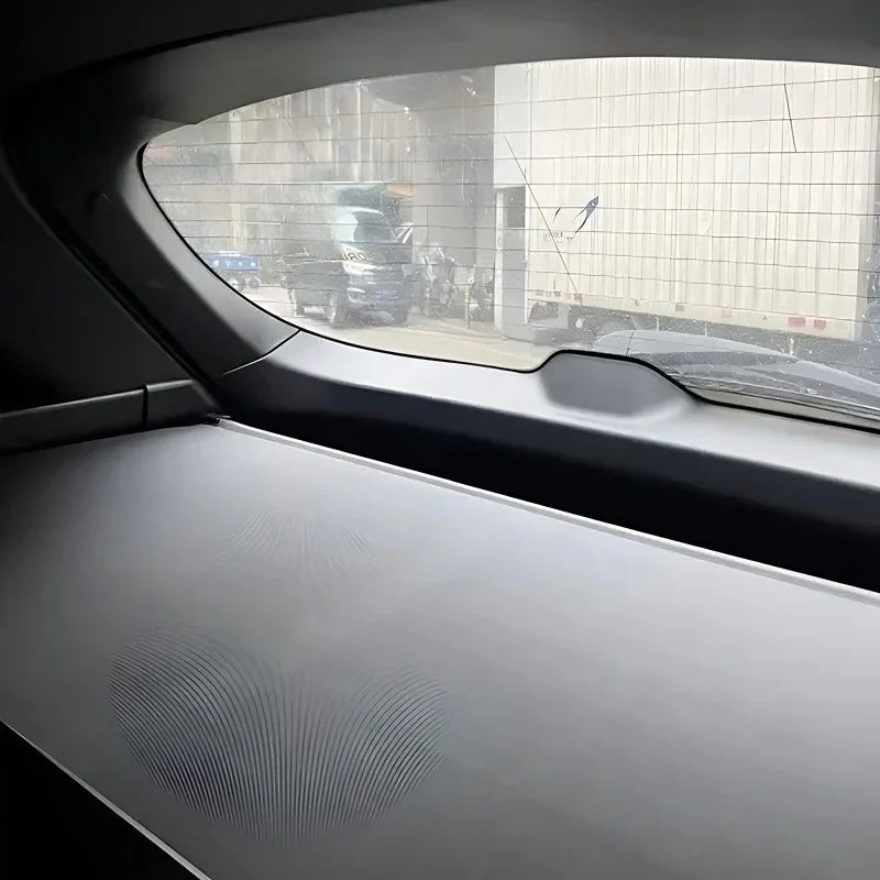 Grey textured leather car dashboard protector with elegant wavy pattern design.