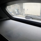 Grey textured leather car dashboard protector with elegant wavy pattern design.