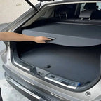 Black fabric trunk cargo cover for BYD, providing a custom fit and sleek protective finish.