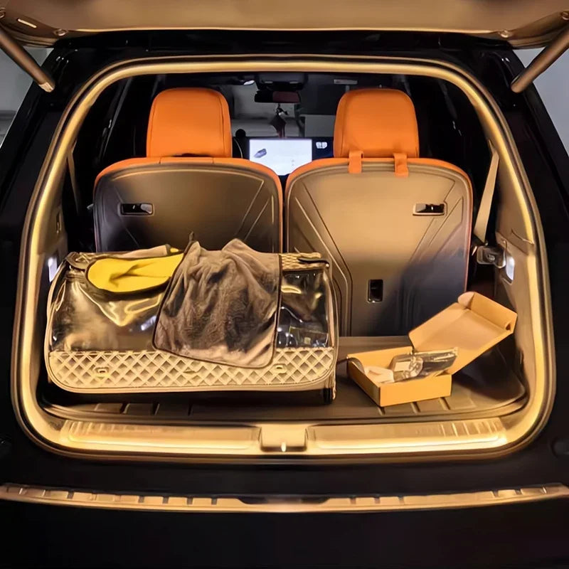 Brown quilted leather car trunk mat with protective cover in a vehicle with orange seats.