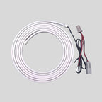 Coiled white LED strip light with black and red wiring and connectors for car customization.