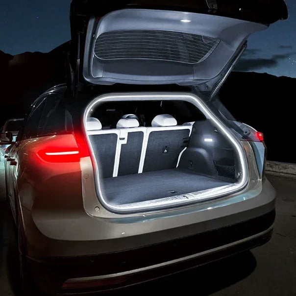 Illuminated interior of a BYD SUV trunk featuring a custom-fit white LED strip light for visibility.