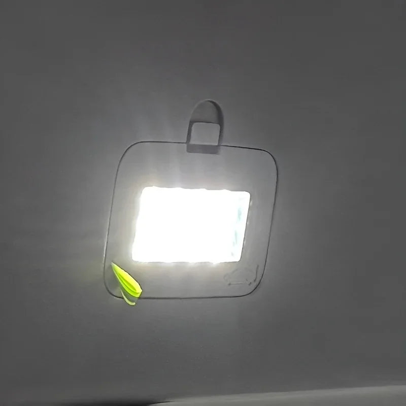 Bright interior dome light illuminating a car ceiling.