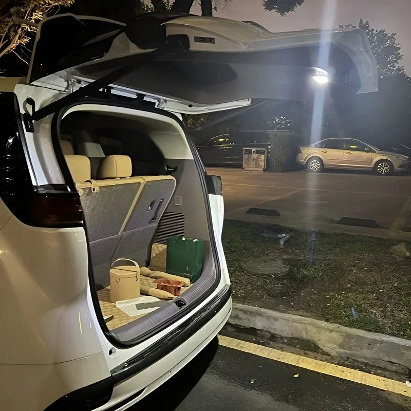 White BYD SUV trunk featuring custom tan leather seat covers and a protective cargo tray.