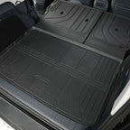 Black heavy-duty rubber cargo mat protecting the rear trunk area of a vehicle.