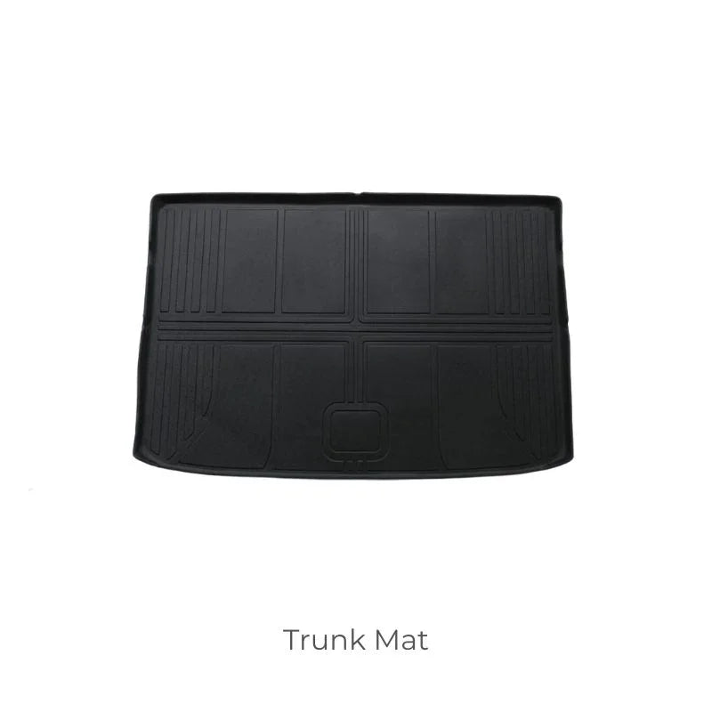 Durable black rubber trunk mat with custom-fit grooves for superior spill protection.