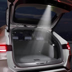 White BYD car trunk with grey custom-fit protective cargo mat under bright LED lighting.