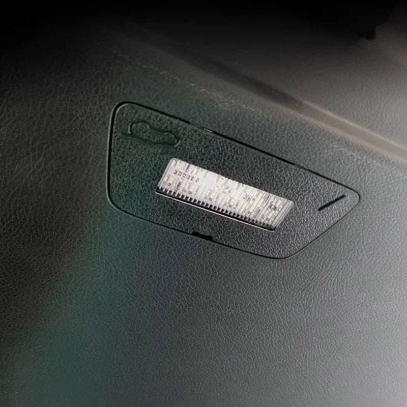 Black textured interior trim featuring a built-in rectangular LED light strip.