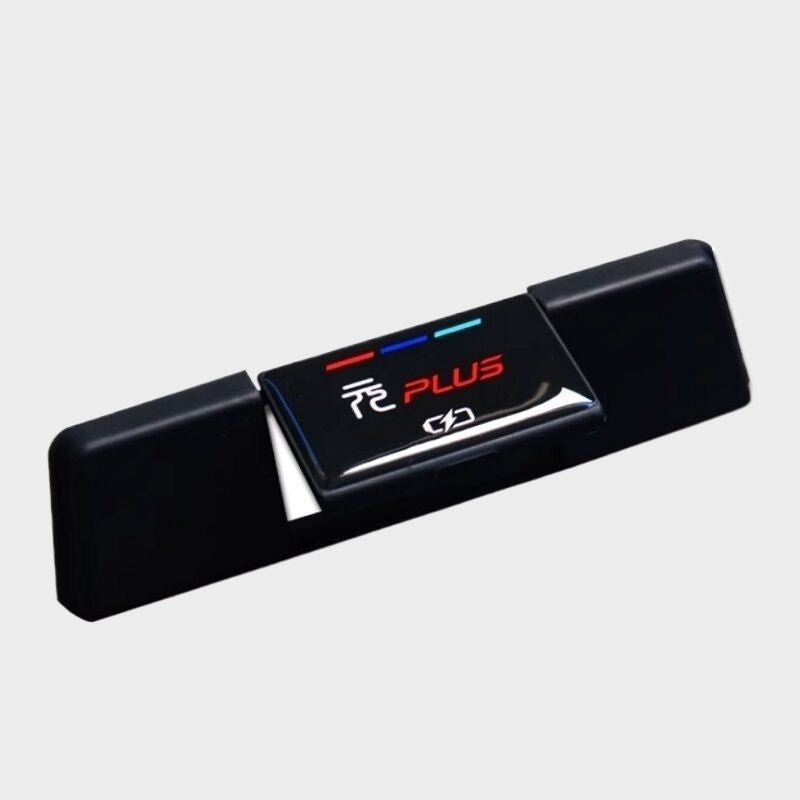 Black glossy BYD Plus interior accessory with red and blue accent stripes.