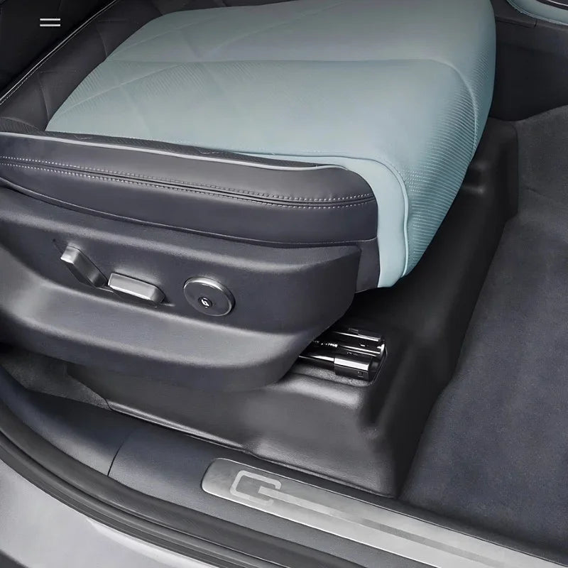 Light blue textured leather car seat with black trim and premium stitching.