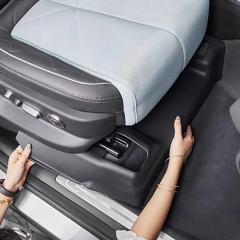 Black durable waterproof side seat protector for BYD car interior with light blue leather seat.