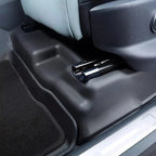 Black heavy-duty TPE floor mats and protective side trim for car interior durability.