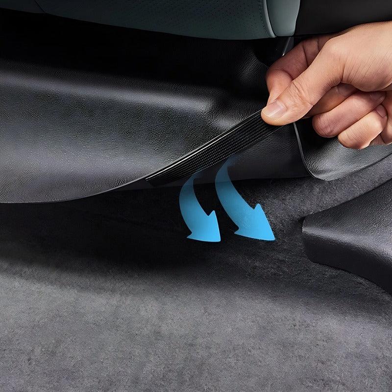 Black premium leather car floor mat being installed for custom protection.