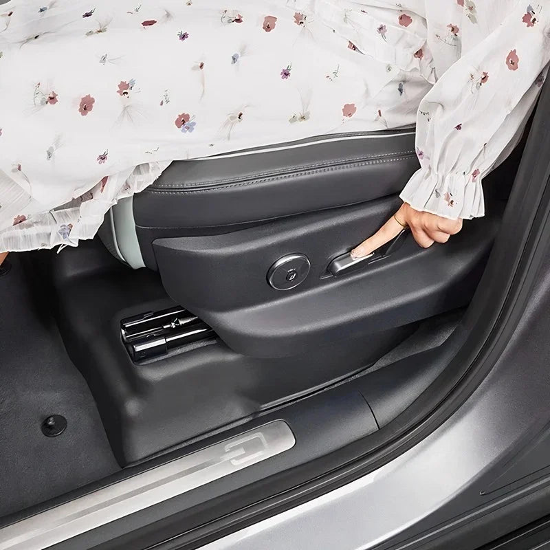 Black premium leather car seat with a side adjustment lever for ergonomic comfort.