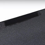 Black textured faux leather material with a seamless edge detail for premium car interior protection.