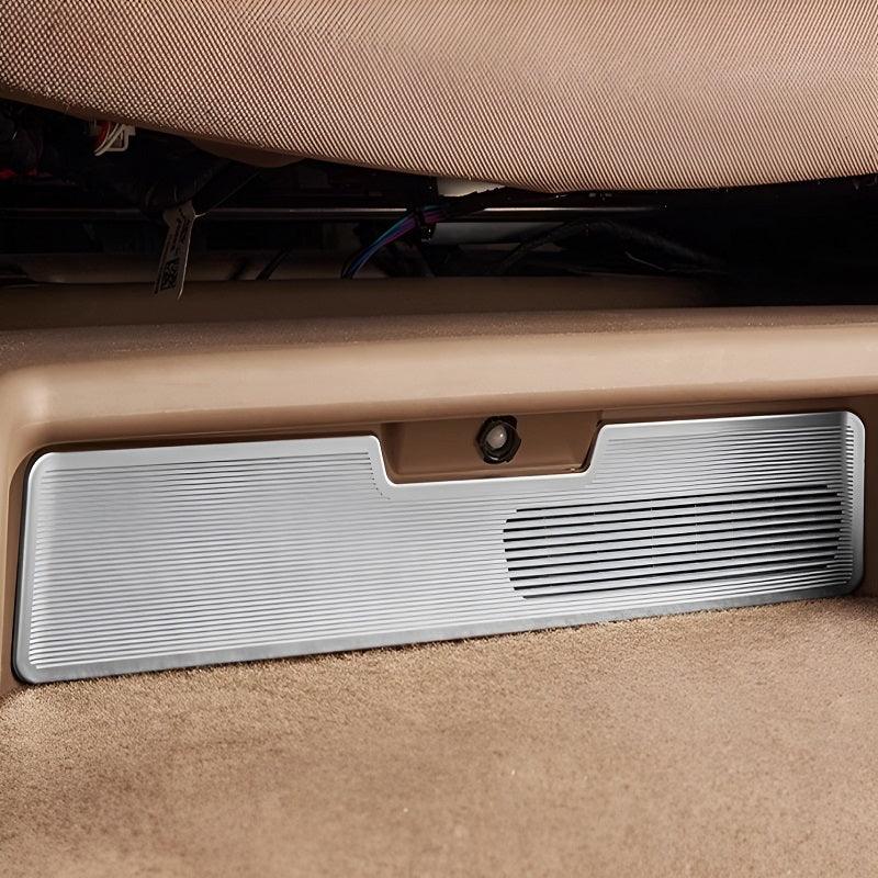 Silver brushed aluminum interior car trim panel with a ribbed texture and sleek finish.