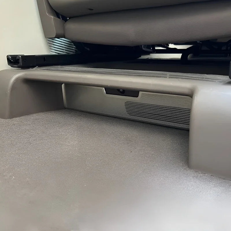 Gray durable car interior floor mat protecting the vehicle trunk area.