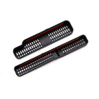Black textured plastic car interior trim covers with red accent detailing.