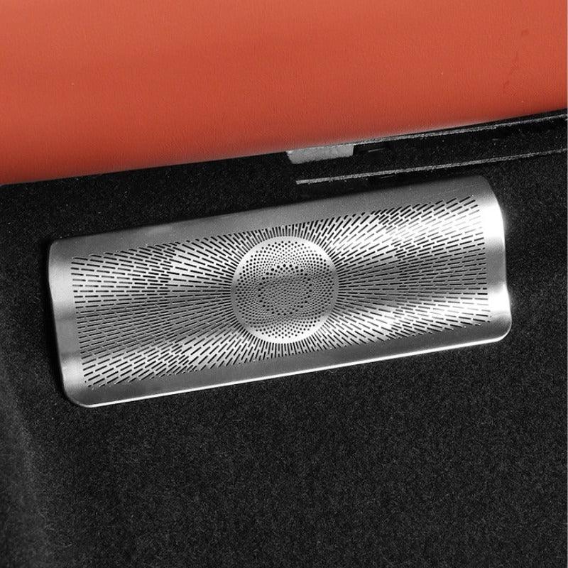 Silver stainless steel decorative trim with a radial perforated pattern on black interior.