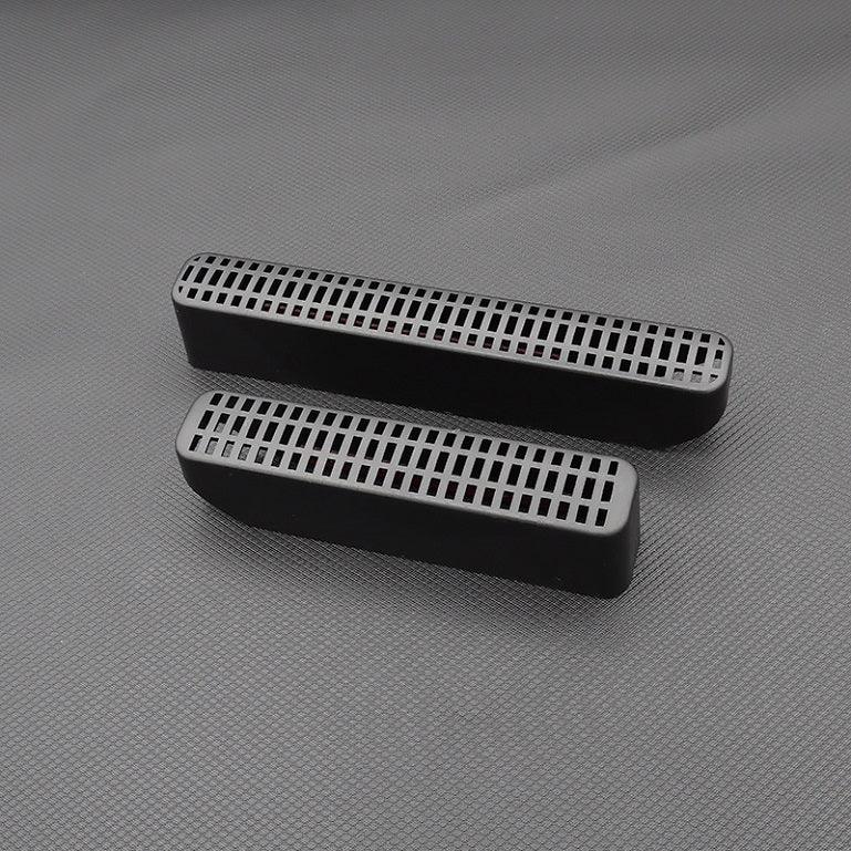 Black matte textured plastic air vent grille covers for automotive interior protection.