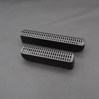 Black matte textured plastic air vent grille covers for automotive interior protection.