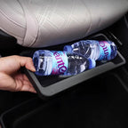 Matte black plastic car seat back organizer holding two water bottles