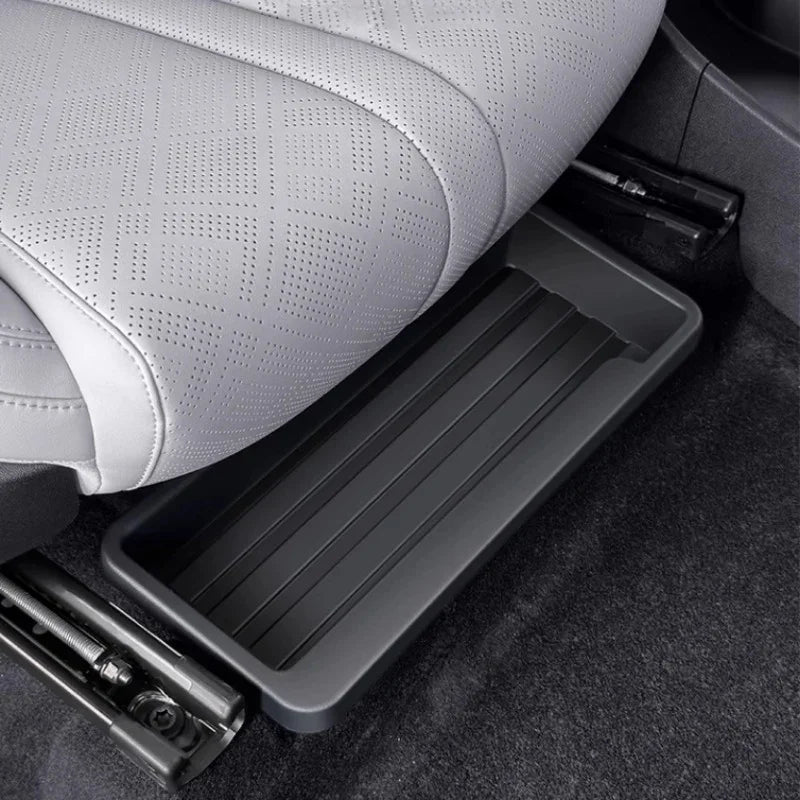 Professional grey durable plastic under-seat storage tray for car interior organization.