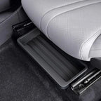 Professional black plastic under-seat storage organizer tray for car interior.