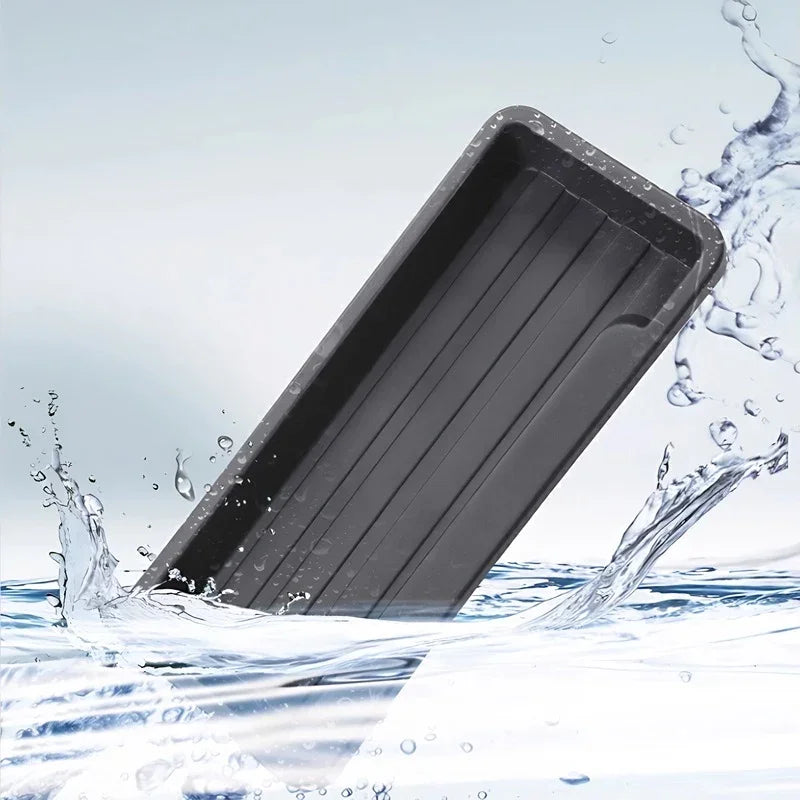 Water-resistant black silicone car organizer tray with drainage grooves and waterproof finish.