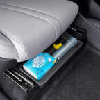Grey durable plastic under-seat storage organizer for car interiors holding essentials.