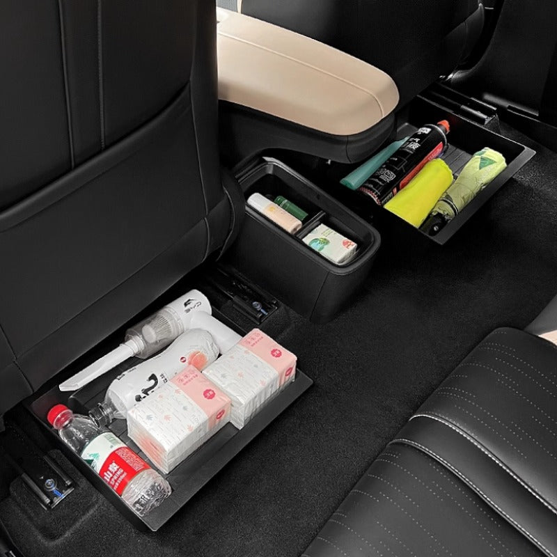 Black heavy-duty car seatback organizer trays holding bottles and essential supplies.