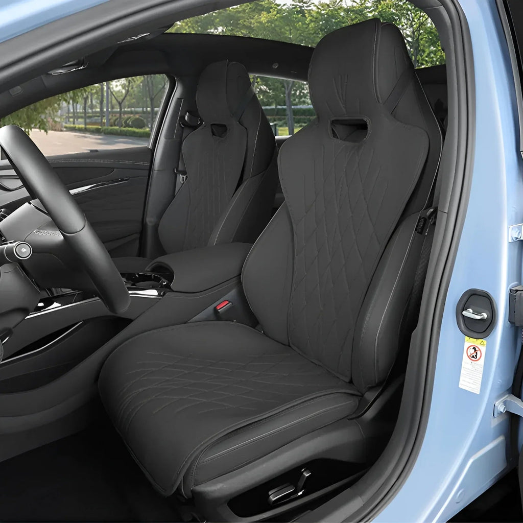 Custom black faux leather car seat covers with diamond quilted stitching for BYD interiors.