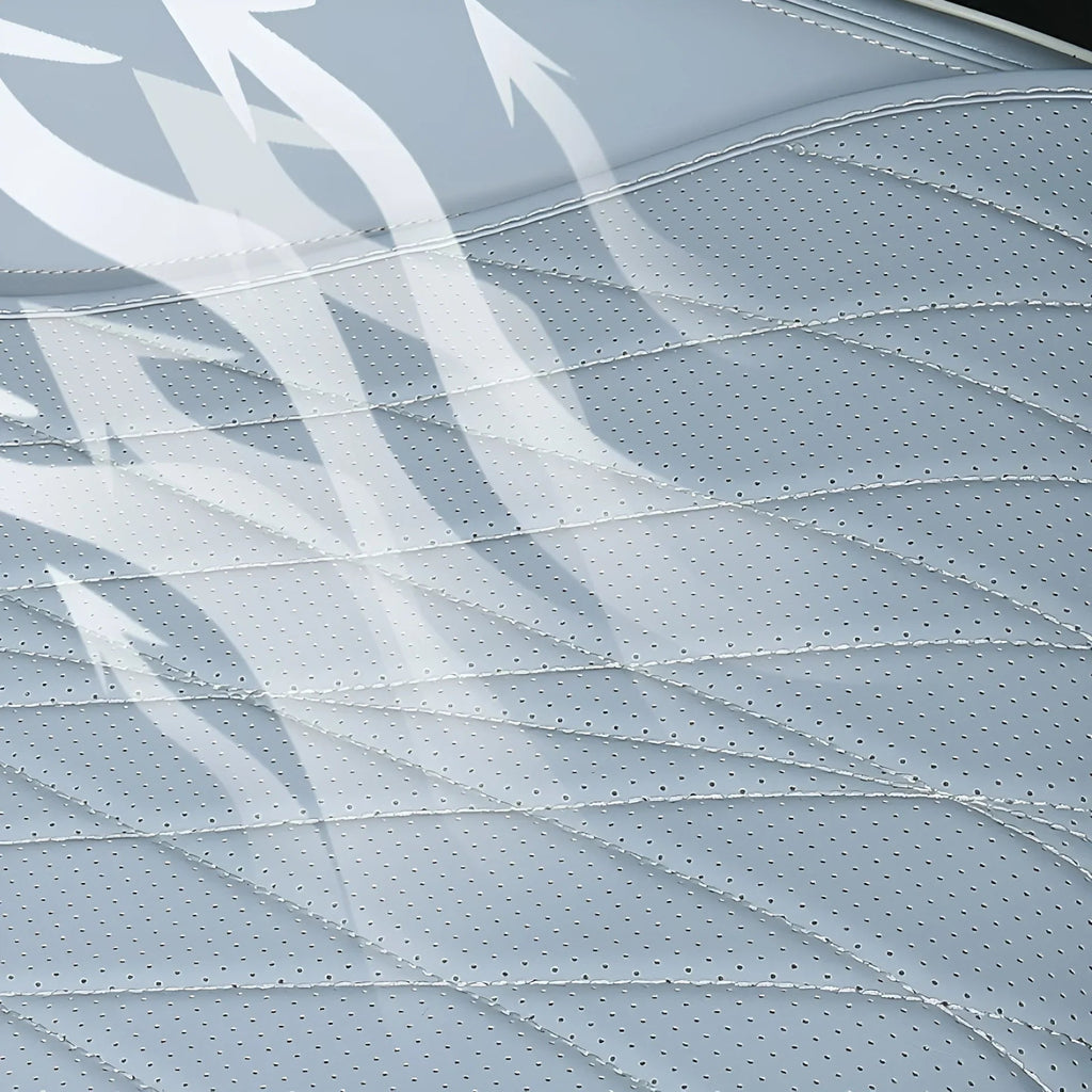 Close-up of breathable perforated light grey leather car seat material with air flow illustration.
