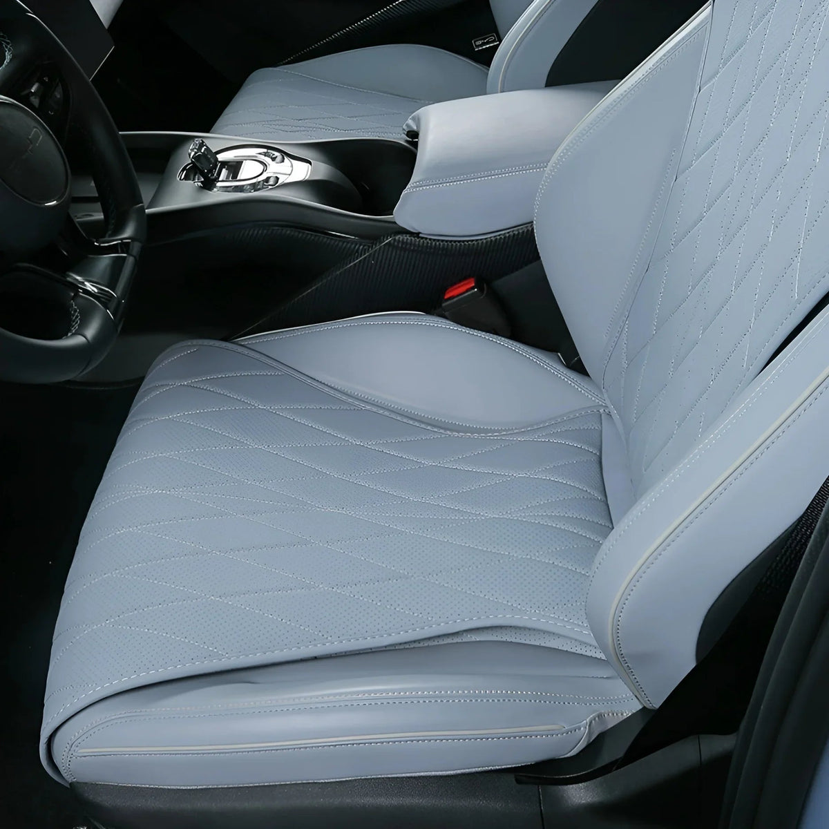 Light blue quilted leather car seat covers with premium stitching for a luxury interior.