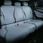 Light grey diamond-quilted leather car seat covers for rear passenger seats.